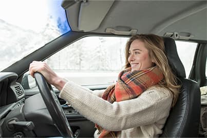 Woman driving in the snow